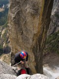 crw_8541 Rich on the second rappel into the Lost Arrow Spire notch. Yosemite falls in the lower right.