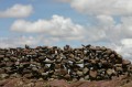 img_8290 Flimsy stone wall against the blue sky.