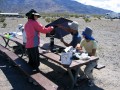 deathvalley44-x Using my umbrella as a wind barrier while preparing lunch the next day.